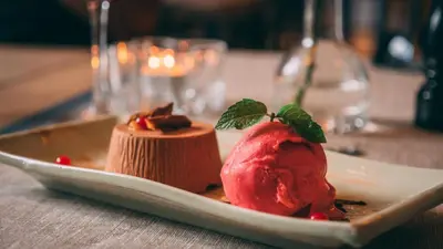 a dessert on a plate on a table at Granavolden Hotel & Gjæstgiveri in Gran