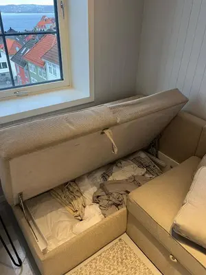 an empty box in a room with a window at Nice and central apartment in Sandviken with sea view in Bergen