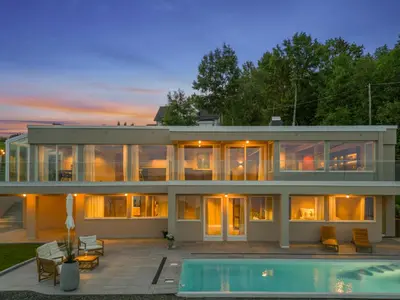 a house with a pool in front of it at Villa with pool and panorama - friend trip,company outing in Trondheim