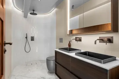 a bathroom with two sinks and a toilet at Villa with pool and panorama - friend trip,company outing in Trondheim