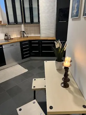 a kitchen with a table with a candle on it at Apartment in the heart of Bergen in Bergen