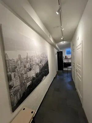 a hallway with a picture of a city on the wall at Apartment in the heart of Bergen in Bergen