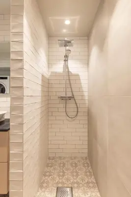 a bathroom with a shower with a shower head at Nice apartment with three bedrooms in the middle of Bergen! in Bergen