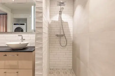 a bathroom with a sink and a shower at Nice apartment with three bedrooms in the middle of Bergen! in Bergen