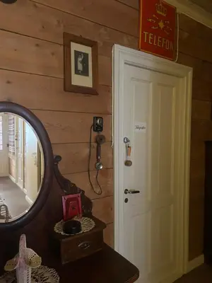 a mirror in a room with a door and a mirror at Davik Fjordparadis