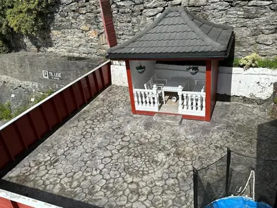 a model of a gazebo with a table at Apartment centrally with garage and terrace in Ålesund
