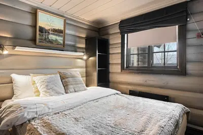 a bedroom with a bed and a window at Trysilfjell nord 590 by Vacation Trysil in Trysil