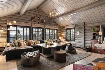 a living room with a couch and a table at Trysilfjell nord 590 by Vacation Trysil in Trysil
