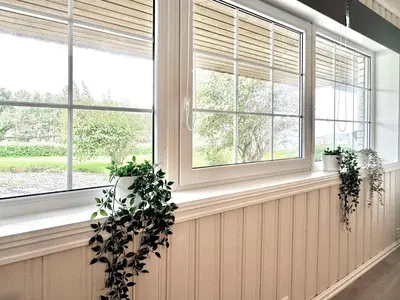 a room with two windows and two potted plants at Apartment centrally located in Bud in Bud