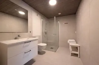 a bathroom with a sink and a toilet and a shower at Modern ski-in-ski-out apartment in Hemsedal in Hemsedal