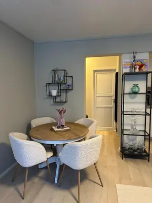a dining room with a table and chairs at Cozy apartment in the middle of Bergen city center in Bergen