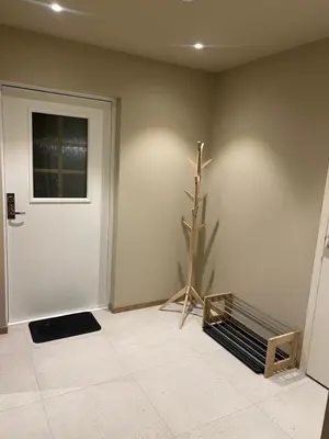 a room with a door and a plant next to it at Nyoppusset leilighet i sentrum in Verdal