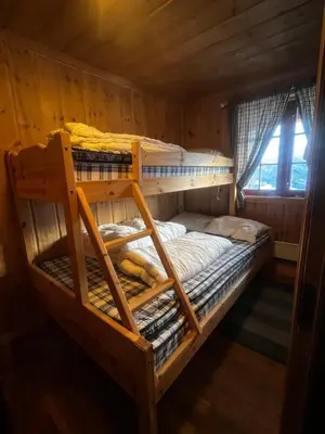 a bedroom with two bunk beds in a cabin at The View - Mountain cabin with stunning views in Stranda