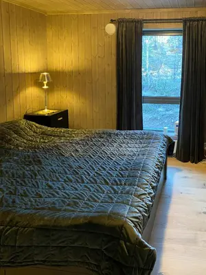 a bedroom with a bed and a window at Cabin With Sauna At Norefjell in Noresund