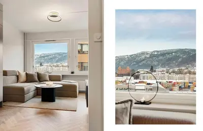 a living room with a couch and a window at Modern and cozy apartment ONLY 5 minutes from City Center in Bergen