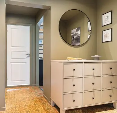 a bathroom with a white dresser and a mirror at Great apartment overlooking Bergen in Bergen
