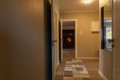 a hallway with a door leading into a room at Spacious Apartment - City Center in Stryn