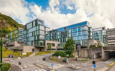an office building with a street in front of it at Central modern apartment in Bergen in Bergen