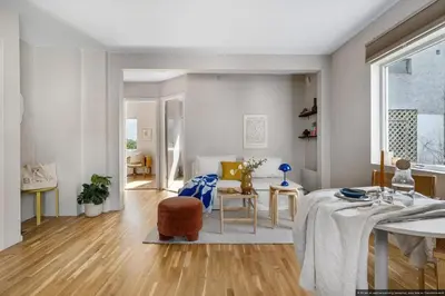 a kitchen and living room with a table and chairs at Cozy Apartment near City Centre in Bergen