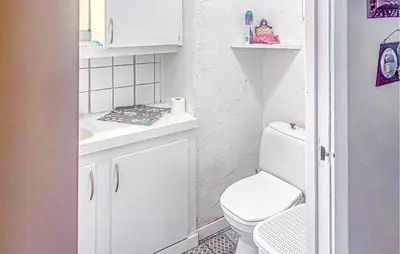 a small bathroom with a toilet and a sink at Cozy Home In Sparbu With Wifi in Sparbu