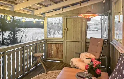 a room with a chair and a table on a balcony at Cozy Home In Sparbu With Wifi in Sparbu