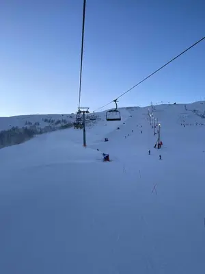 a group of people on a ski lift in the snow at Velkommen til topp leilighet på Strandafjellet 2 soverom og hems in Stranda