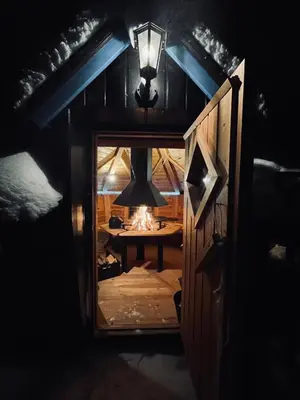 a view of a room with a stove and a light at Valhalla Hytte in Oppdal