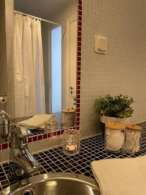 a bathroom with a sink and a mirror at Modern and airy apartment in Bergen city center in Bergen