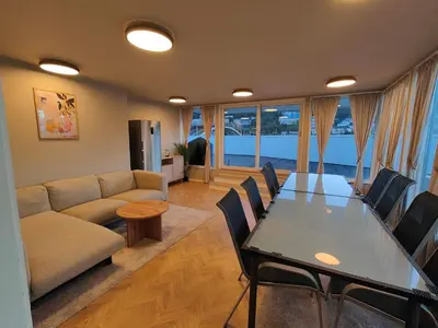 a living room with a table and a couch at Modern apartment in central Bergen in Bergen