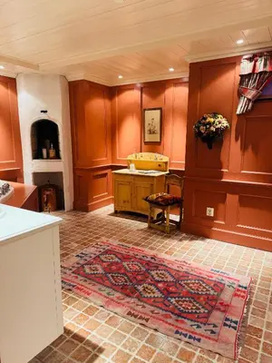 a large room with a sink and a rug at Luxury cabin in the mountains, with sauna and steam shower in Geilo