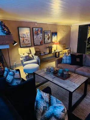 a living room with couches and a coffee table at Luxury cabin in the mountains, with sauna and steam shower in Geilo