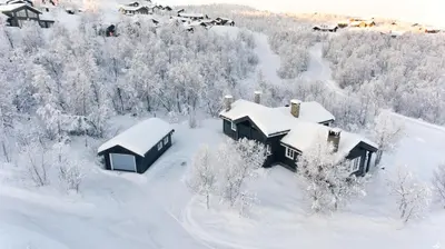 an aerial view of a house covered in snow at Luxury cabin in the mountains, with sauna and steam shower in Geilo