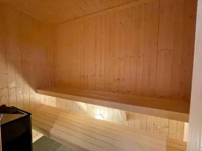 a wooden sauna with a wooden bench in it at Luxurious Cabin, 5 Bedrooms, Sauna Stunning View in Beitostøl