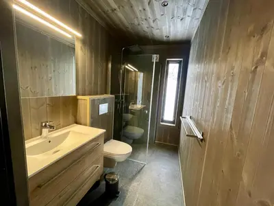 a bathroom with a sink and a toilet at Luxurious Cabin, 5 Bedrooms, Sauna Stunning View in Beitostøl
