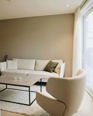 a living room with a couch and a coffee table at Leilighet 101 og 102 i Brunholmgata 9 in Ålesund