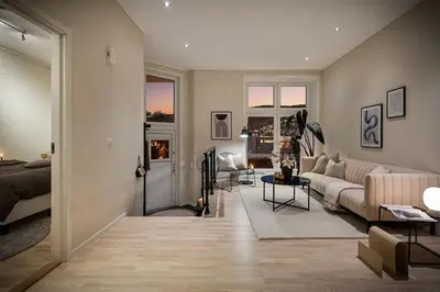 a living room with a couch and a table at Nice apartment near the city center! in Bergen
