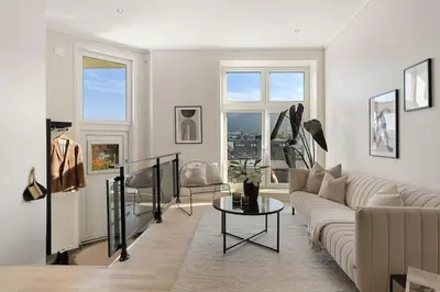 a living room with a couch and a table at Nice apartment near the city center! in Bergen