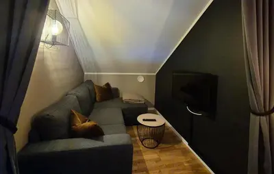 a living room with a couch and a tv at 2 Bedroom Cozy Apartment In Røldal in Røldal