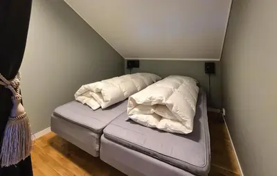 a bed with two pillows on it in a room at 2 Bedroom Cozy Apartment In Røldal in Røldal