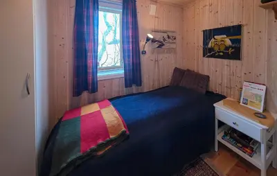 a bedroom with a bed with a colorful blanket at Nice Home In Rauland With Wifi in Rauland