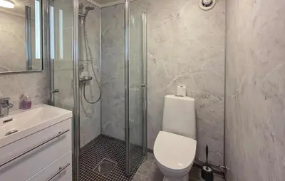 a bathroom with a shower and a toilet and a sink at Nice Home In Rauland With Wifi in Rauland