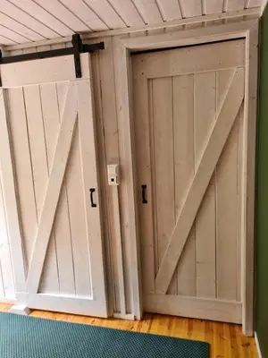a pair of doors in a room at Nordfjordcabins BLUE in Utvik