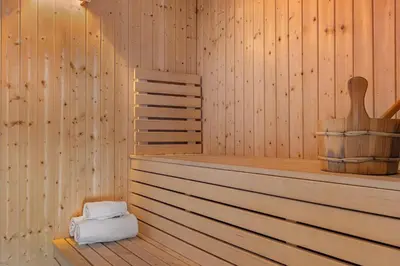 a sauna with a bed and a chair in it at Trysilfjell hytteomrade 589 in Hovi