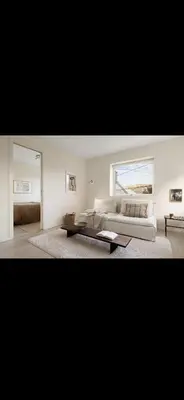 a living room with a couch and a coffee table at Bright and modern apartment close to the city center! 2 bedroom in Bergen