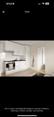 a picture of a kitchen with white cabinets at Bright and modern apartment close to the city center! 2 bedroom in Bergen