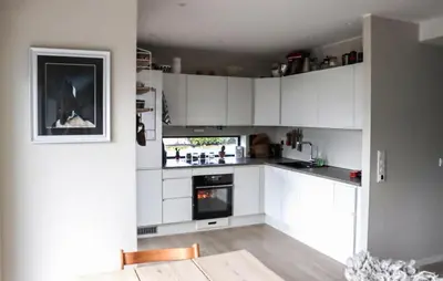 a kitchen with white cabinets and an oven at 3 Bedroom Beautiful Apartment In Voss in Vossevangen