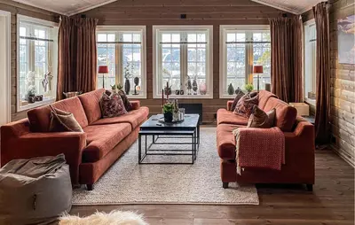 a living room with two couches and a table at Stunning Home In Bjorli With Sauna in Bjorli