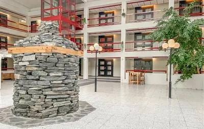 a stone pillar in the middle of a building at Amazing Apartment In Bjorli With Wifi in Bjorli