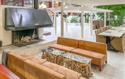 a living room with a couch and a fireplace at Amazing Apartment In Bjorli With Wifi in Bjorli