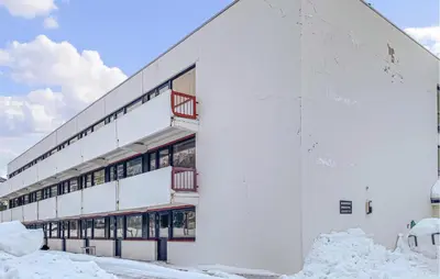 a white building with snow around it at Amazing Apartment In Bjorli With Wifi in Bjorli